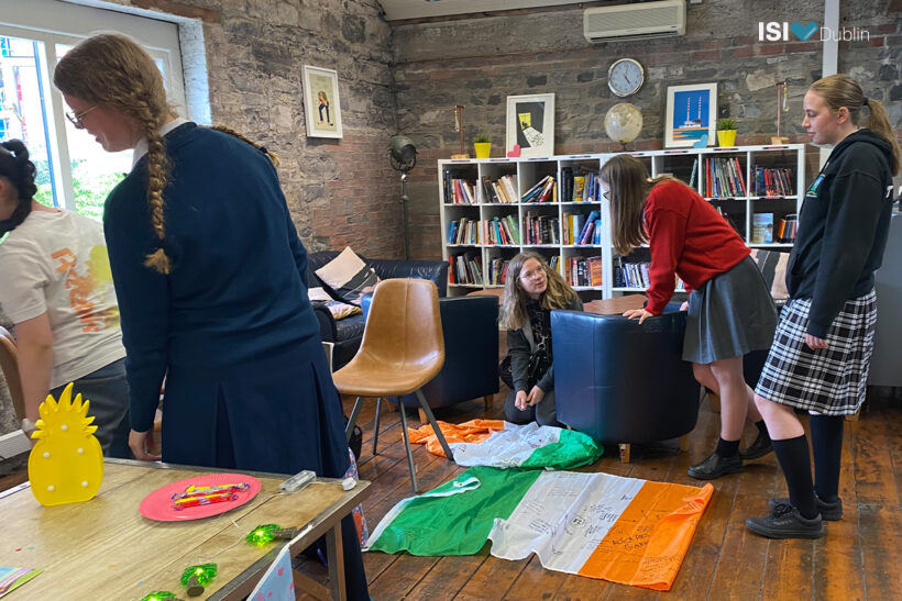 Students Signing Each Others Irish Flags
