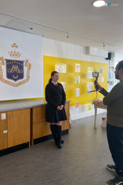 Lea filming at her school