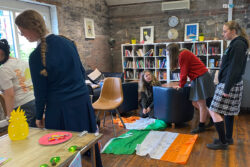 Students Signing Each Others Irish Flags